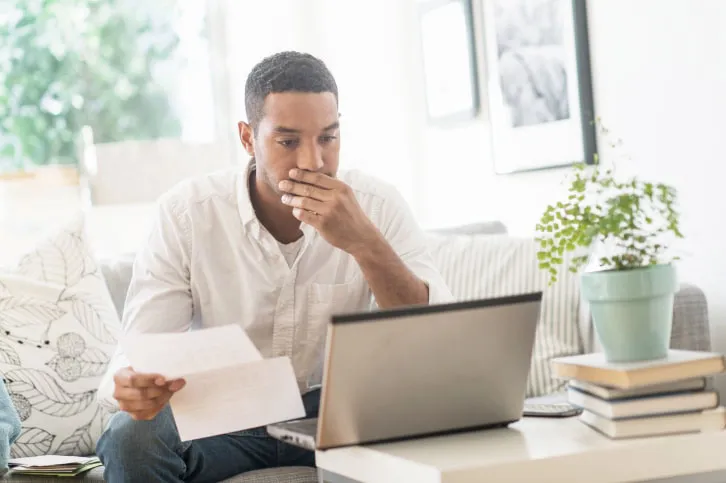 A man looking at his computer