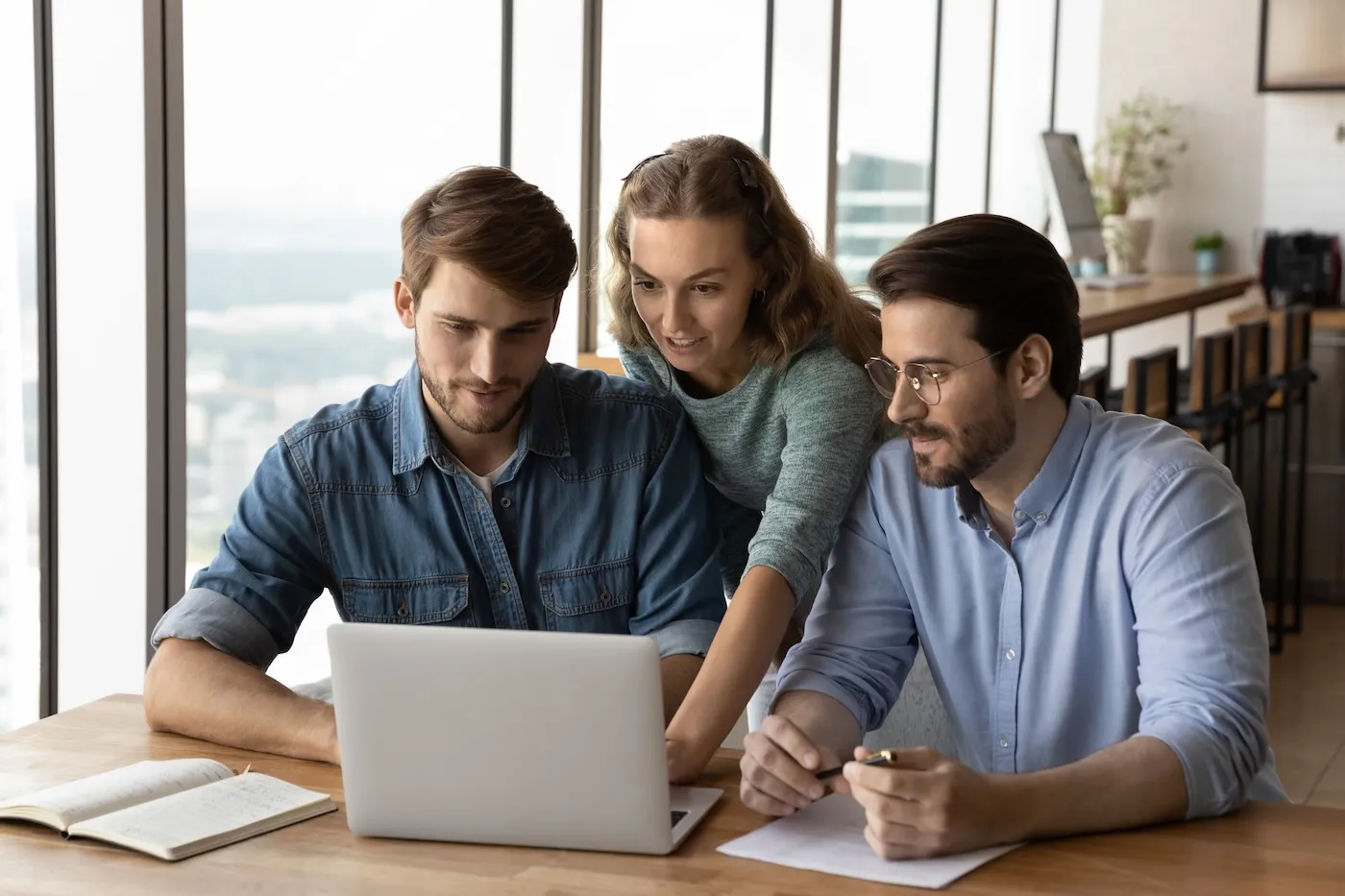 A group of three people deciding what loans to get.