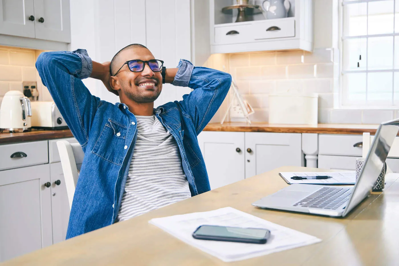 man stretching with relief at being debt free