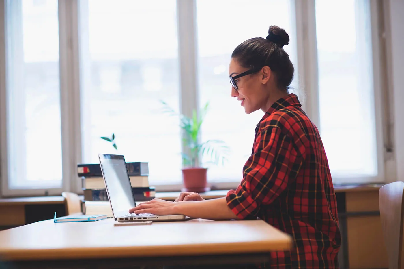 Young woman working on laptop.