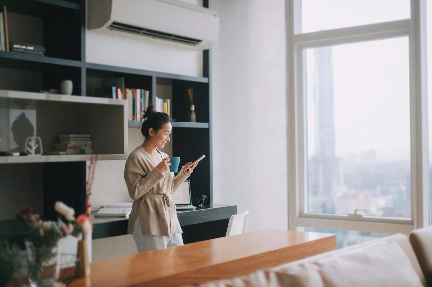 standing woman setting quarterly financial goals on phone