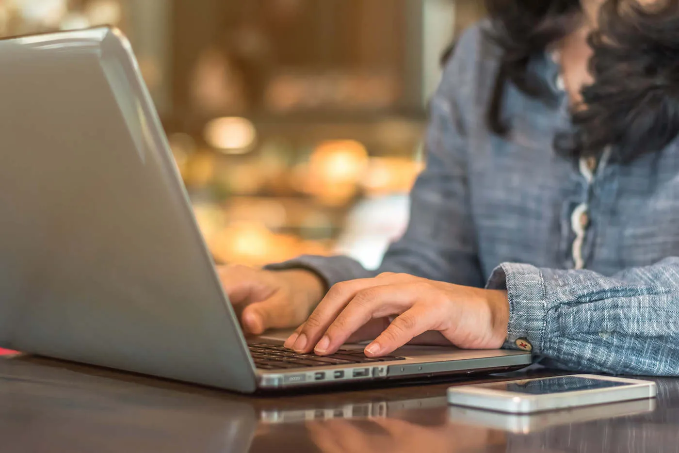 woman typing on laptop