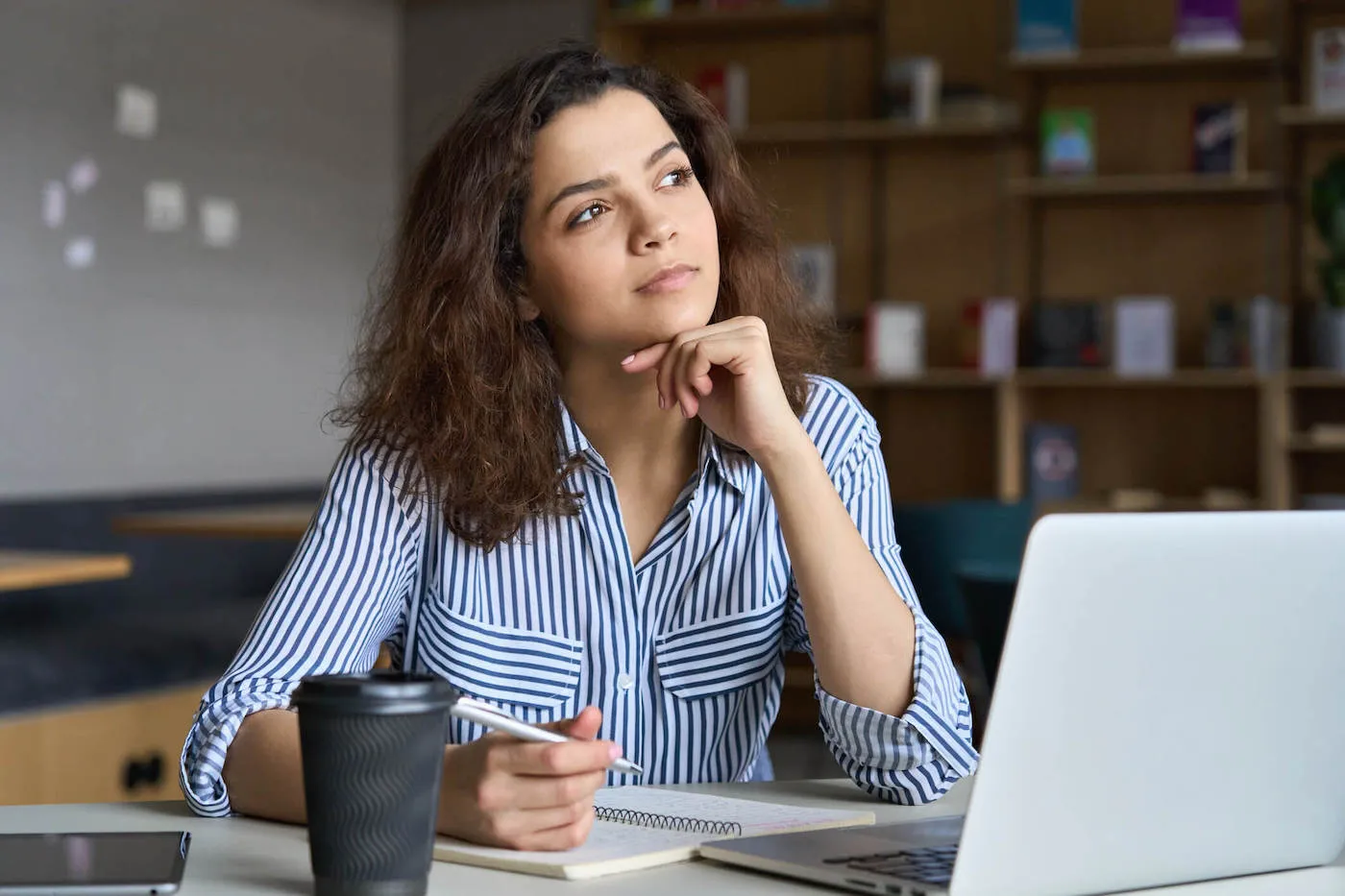 seated woman thinking how to get personal loan