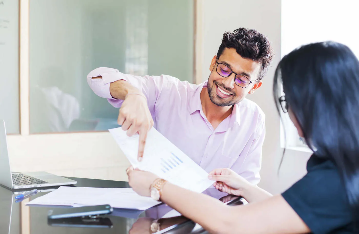 man explaining mutual funds to a woman