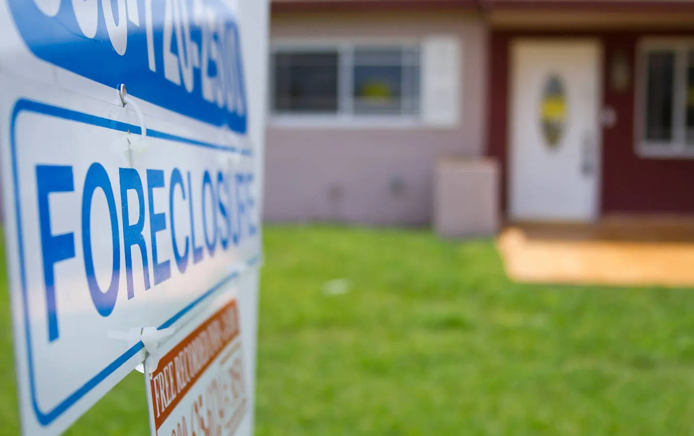 foreclosure sign outside a single family residence