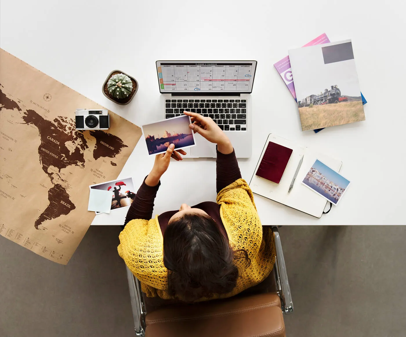 Woman Planning and Scheduling a Vacation at her desk.