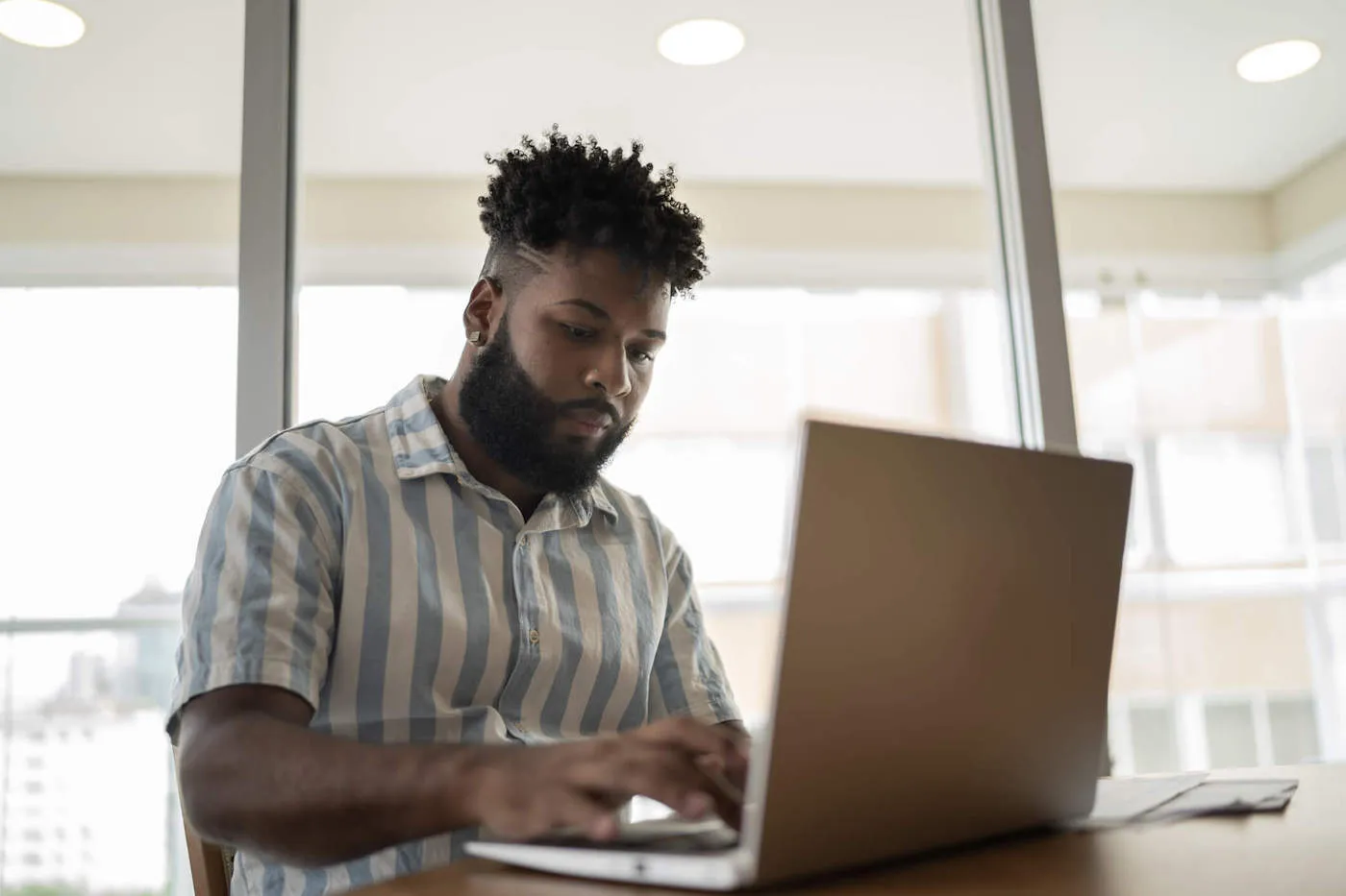 Young man working at home.