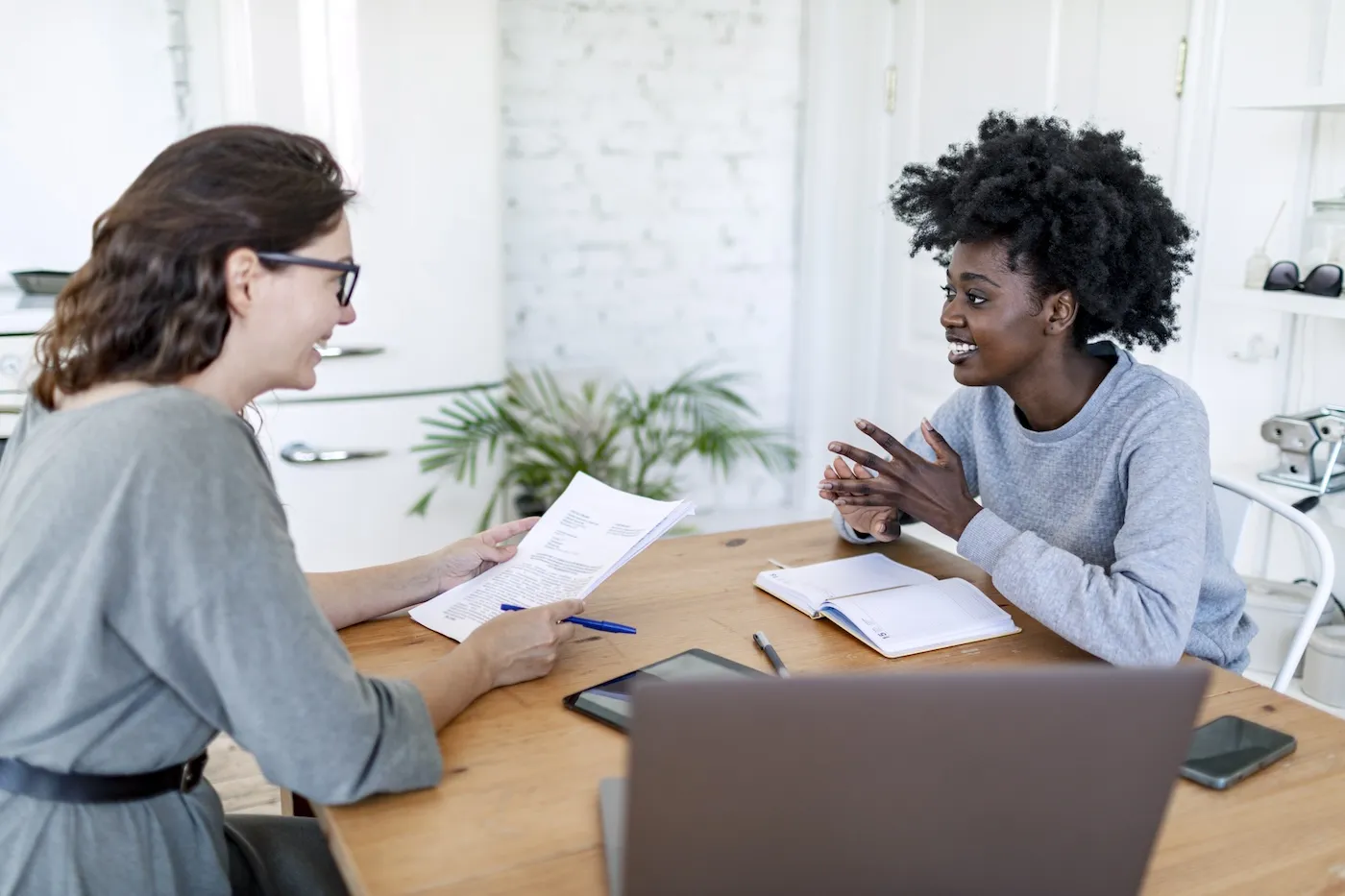 Financial consultant giving to sign new loan agreement to client