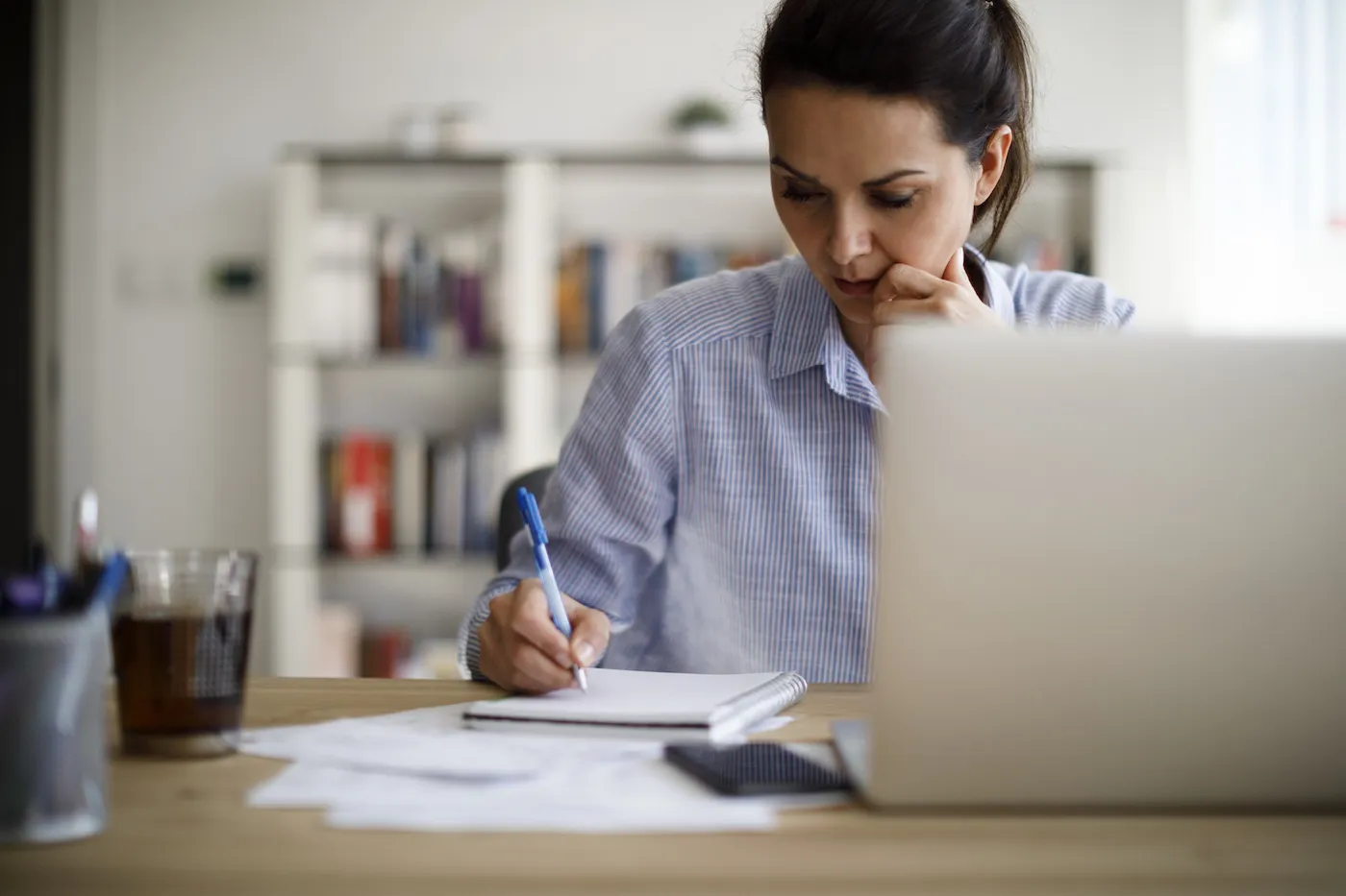 Woman researching why her credit score dropped.