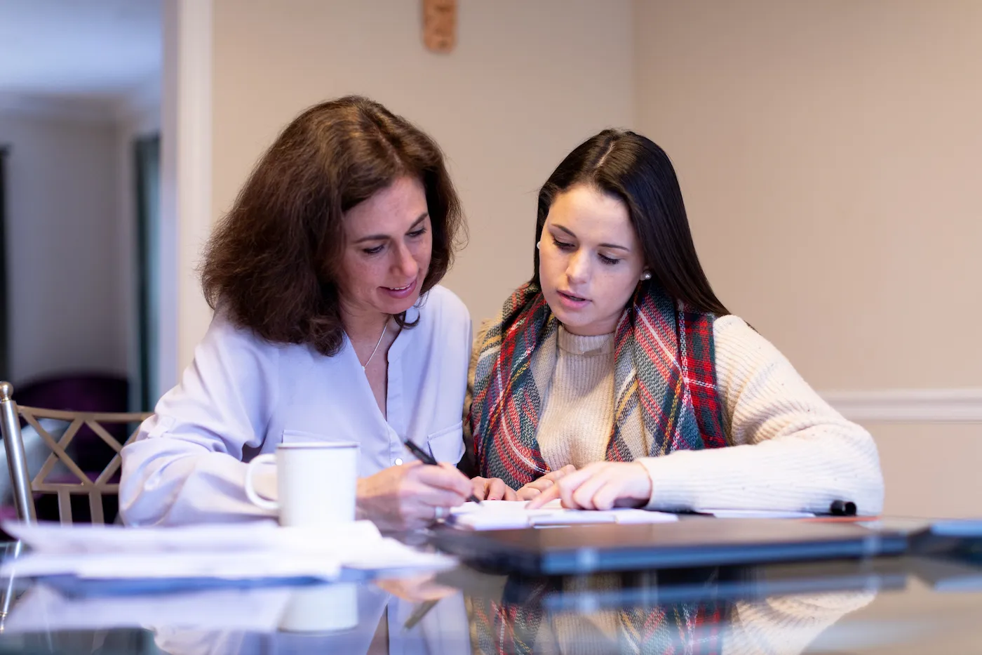 Mother advising her daughter on college finances