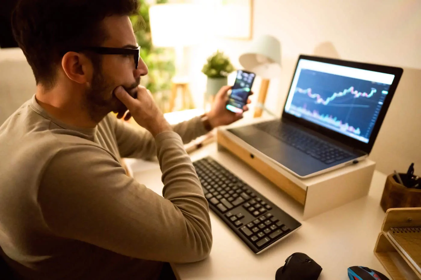 Contemplative man researching best exist strategy for investments.