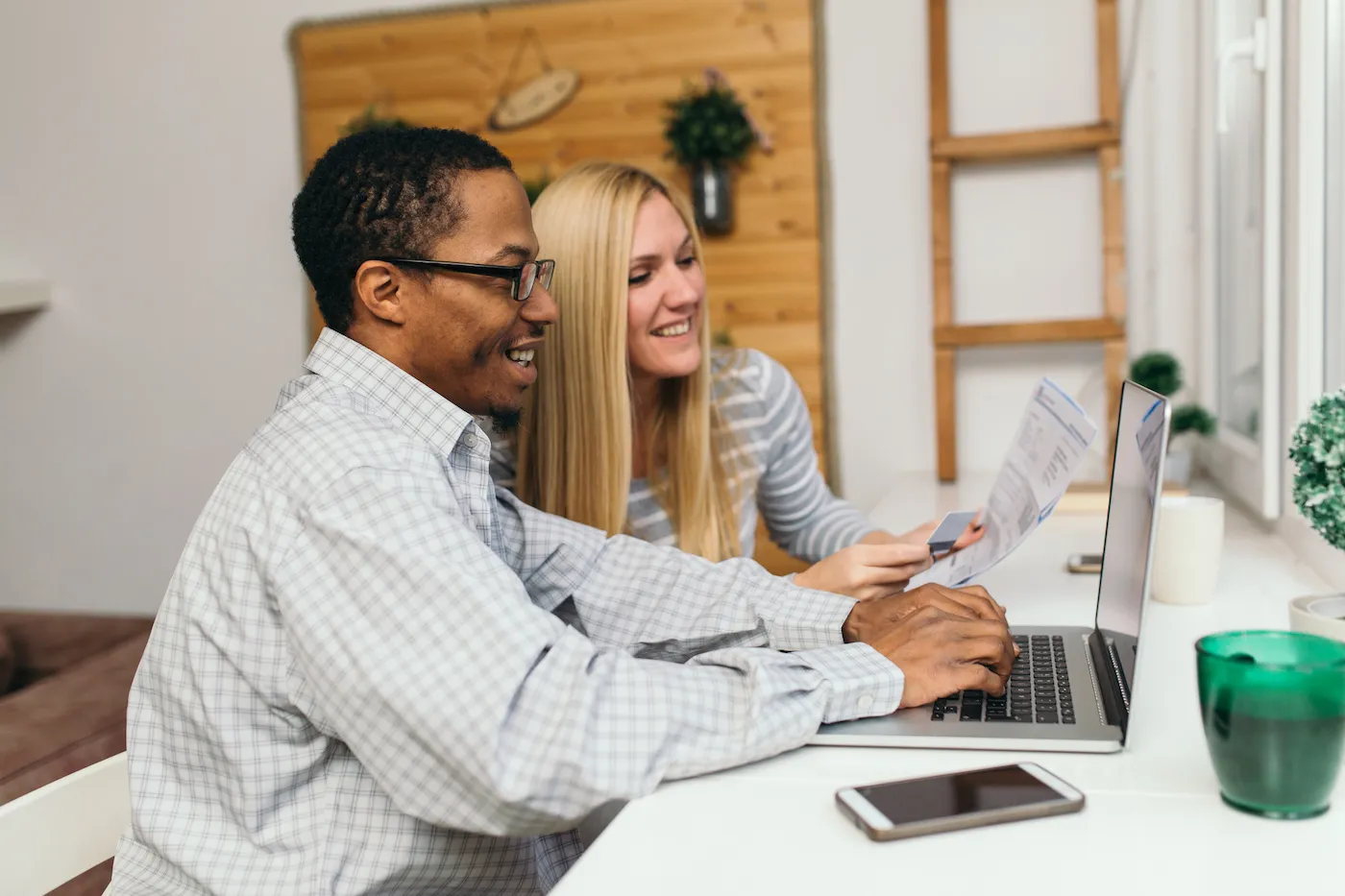 Man and woman paying mortgage taxes