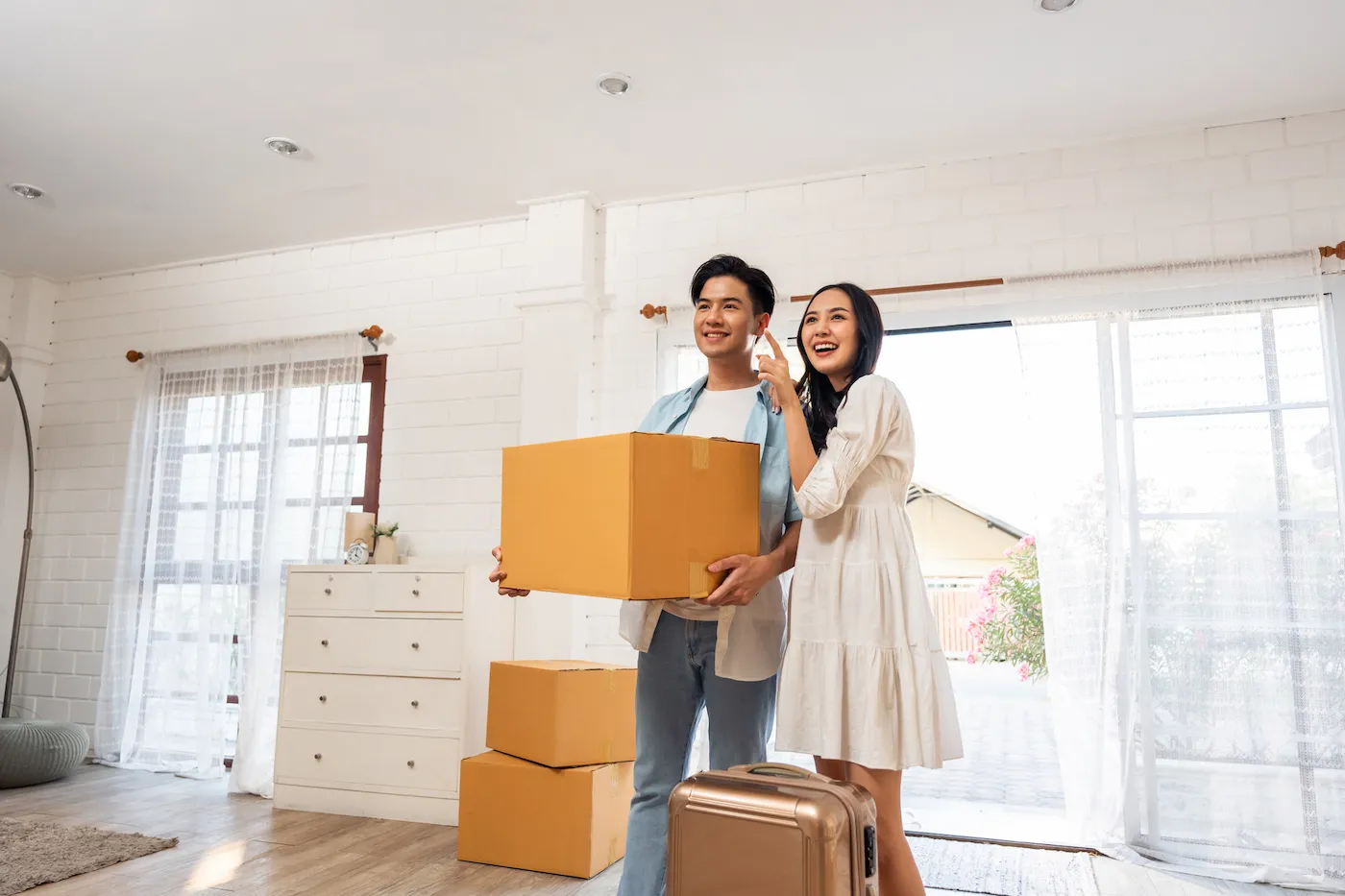 A young happy couple moving into their new house together.