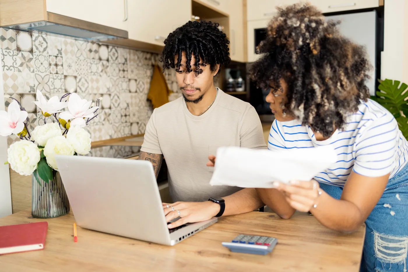 Couple is reviewing their high yield savings account together