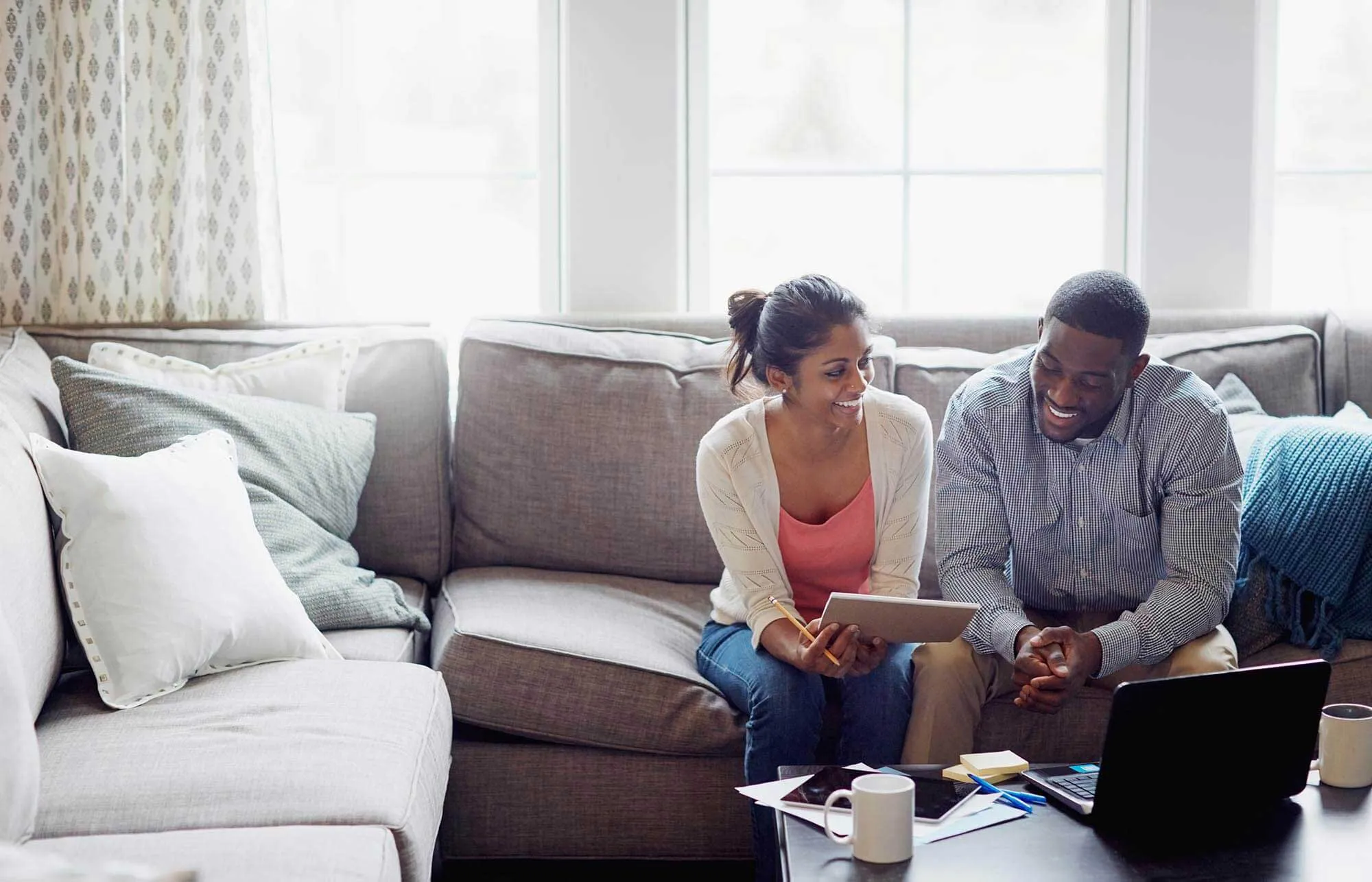 Couple Working on Finance on Couch