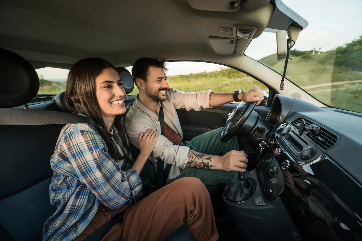 Photo of a happy young couple on a road trip