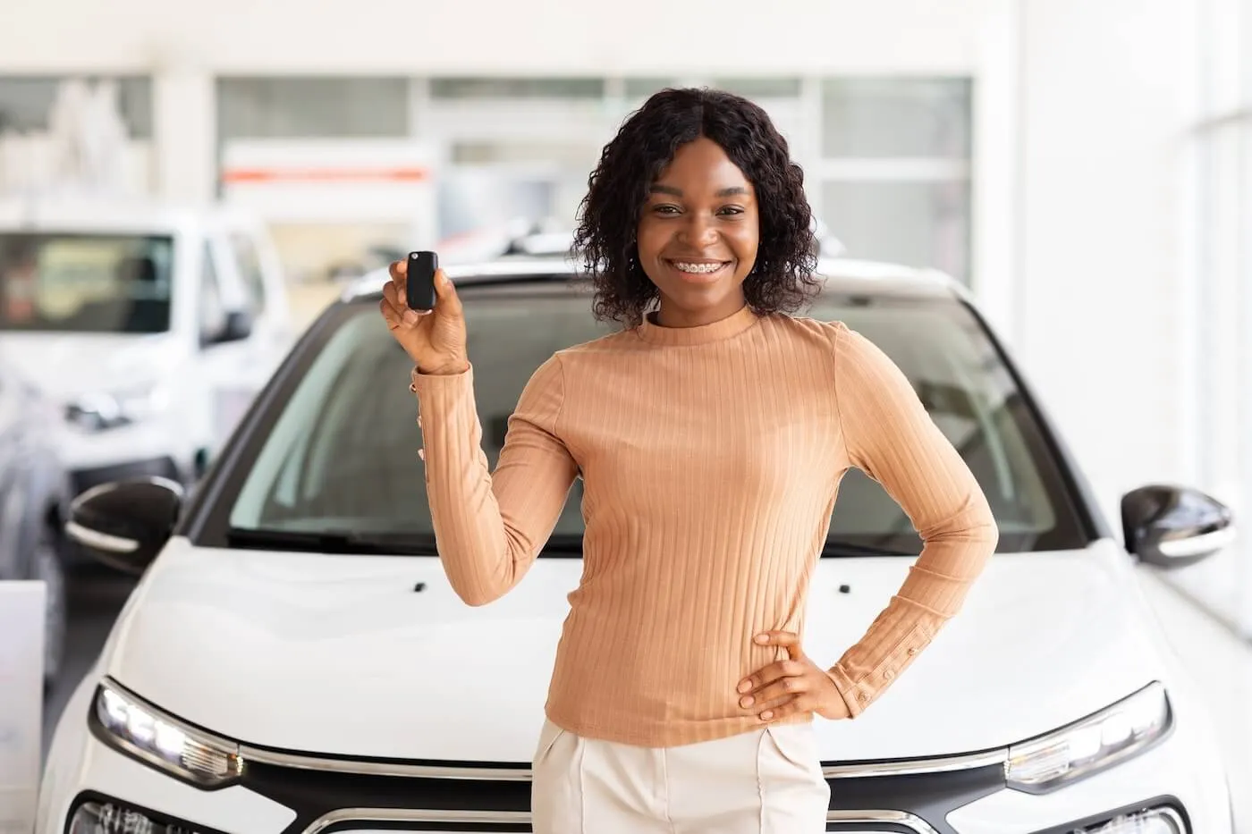 Woman Holding Keys Of Her New Car After Buying