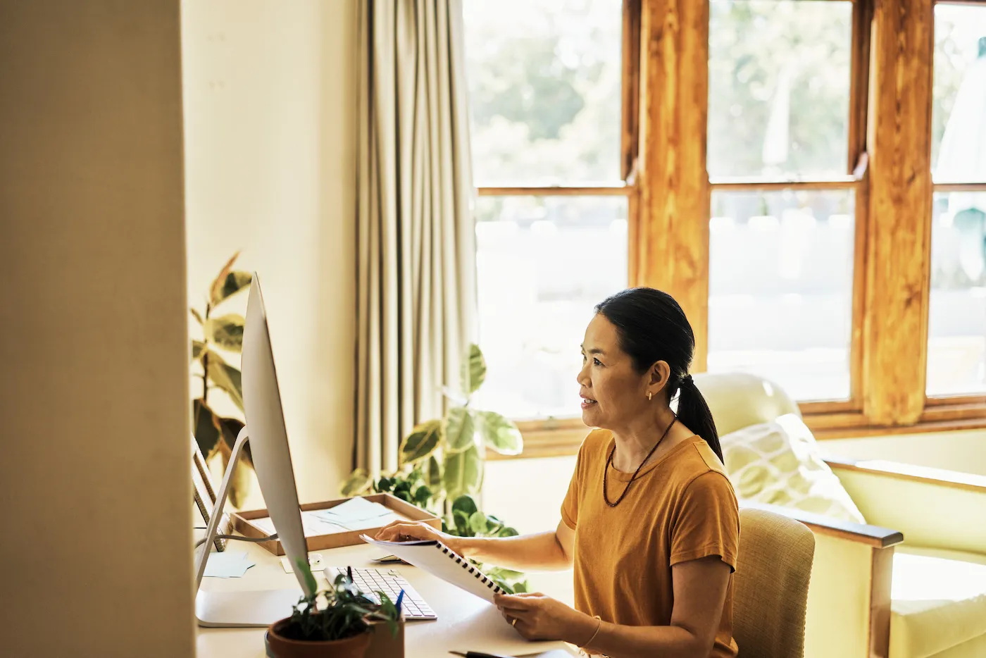 Senior woman using a computer to get the most out of her bank account.