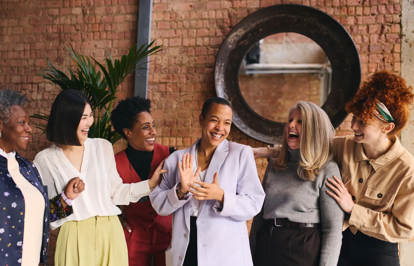 Portrait of cheerful businesswomen celebrating financial security