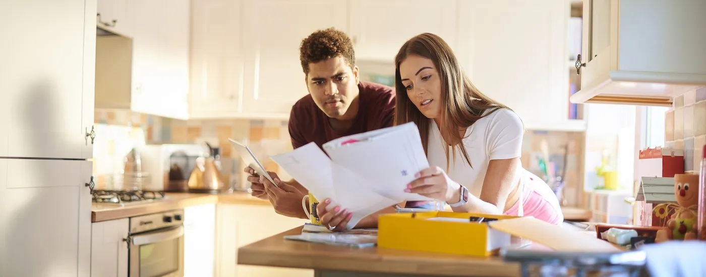 A young couple chatting about home finances.