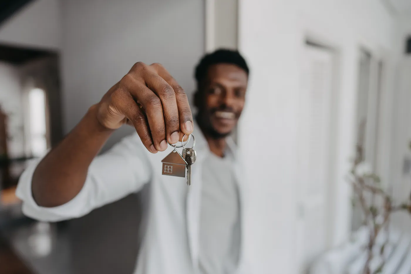 Man holding new house key