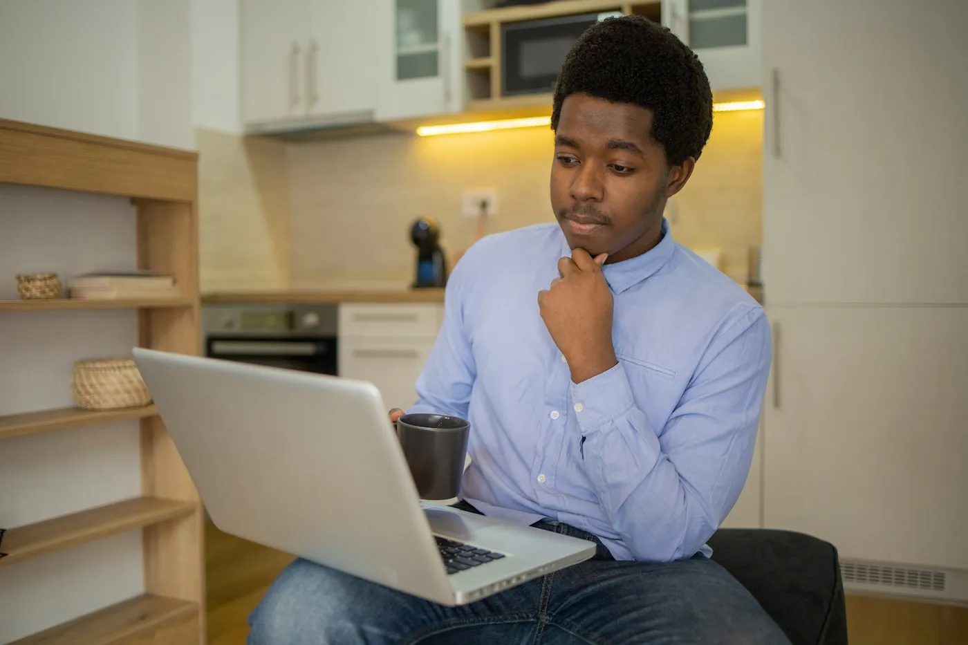 Shot of a young man working from home