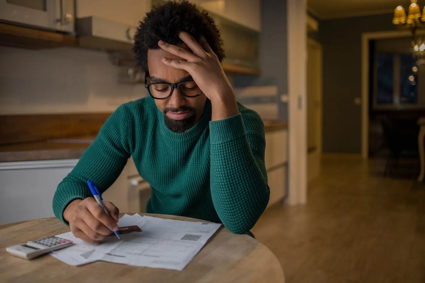 Young man paying bills