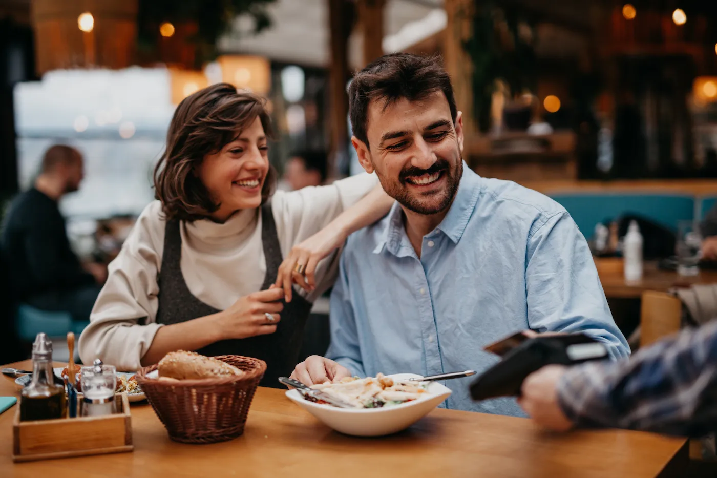 Happy couple enjoying a meal