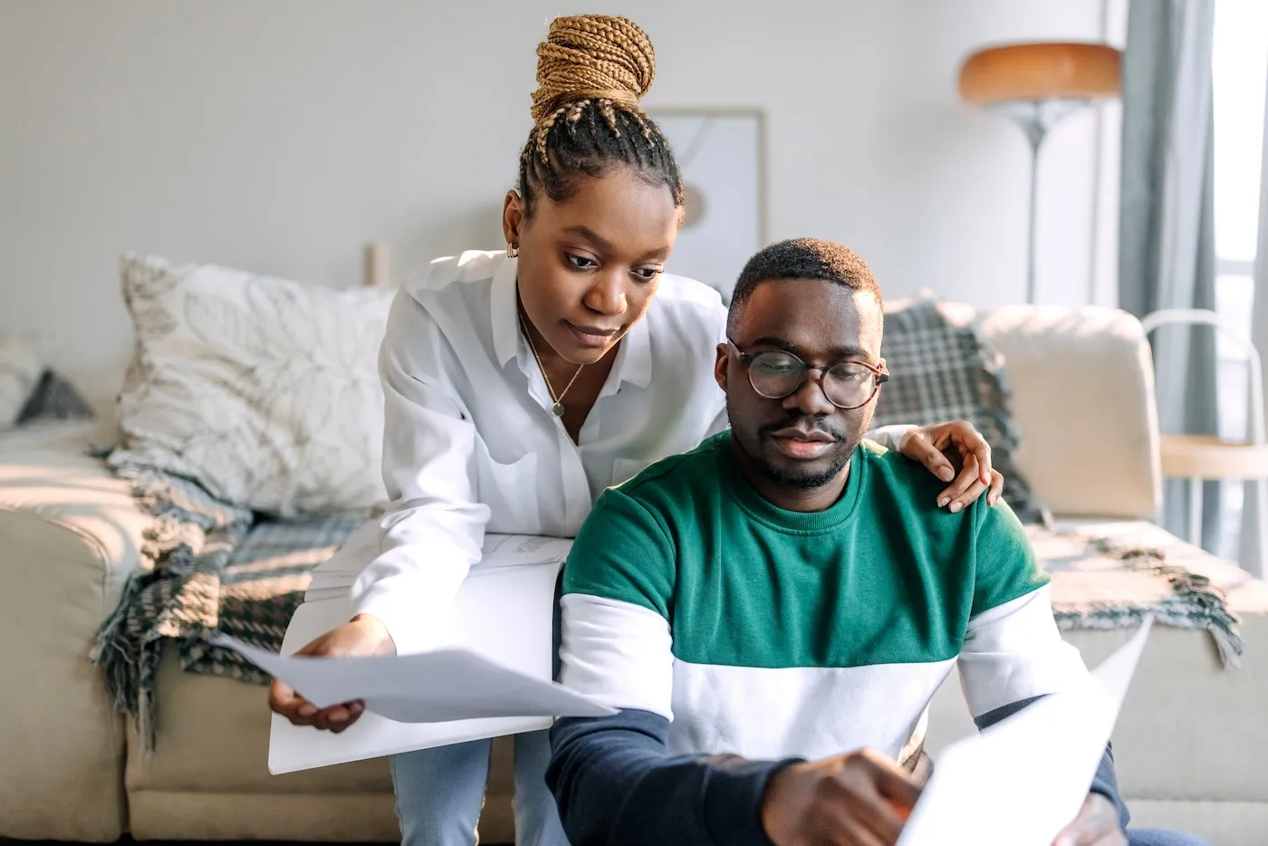 Couple going over bills together at home