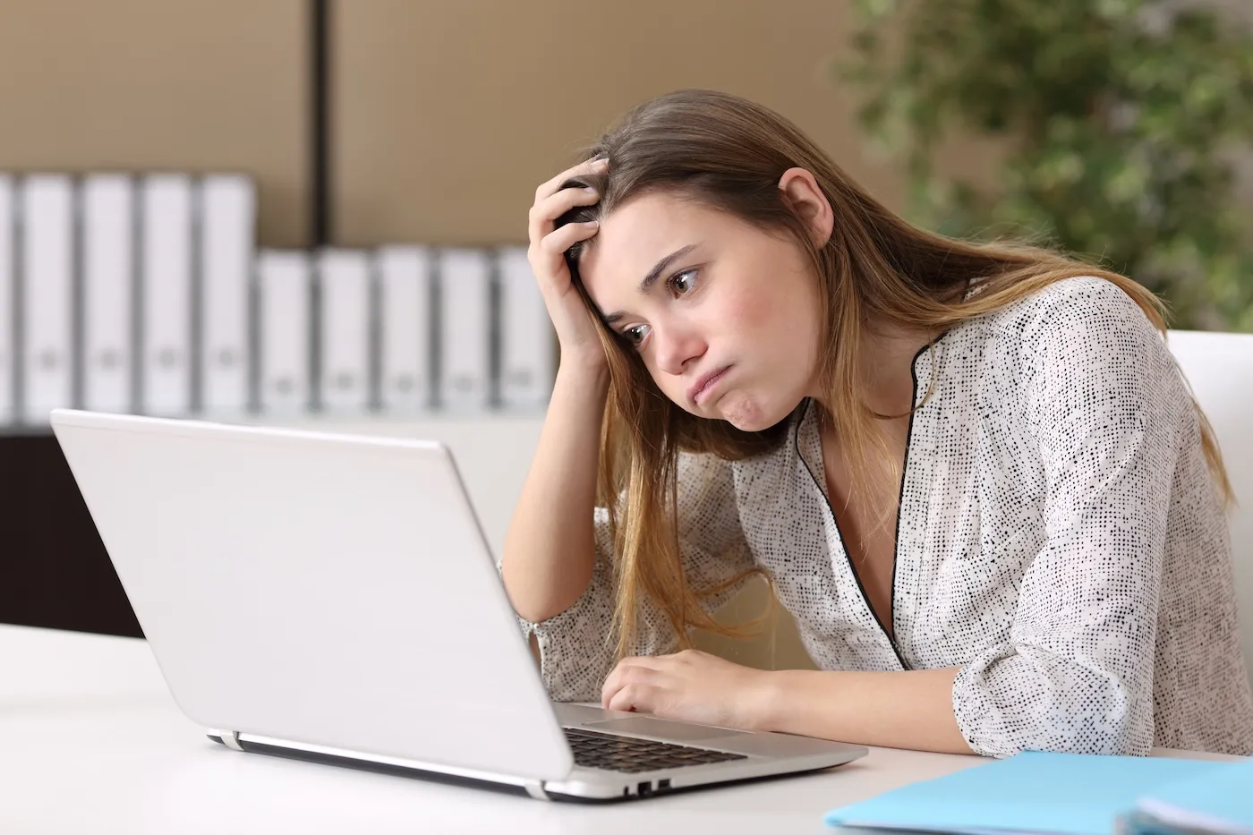 Frustrated woman working online at home