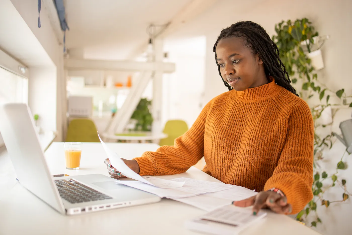 Woman planning how to pay off credit card debt.