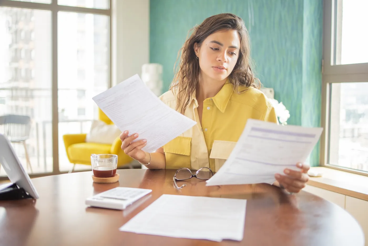 Young woman paying bills