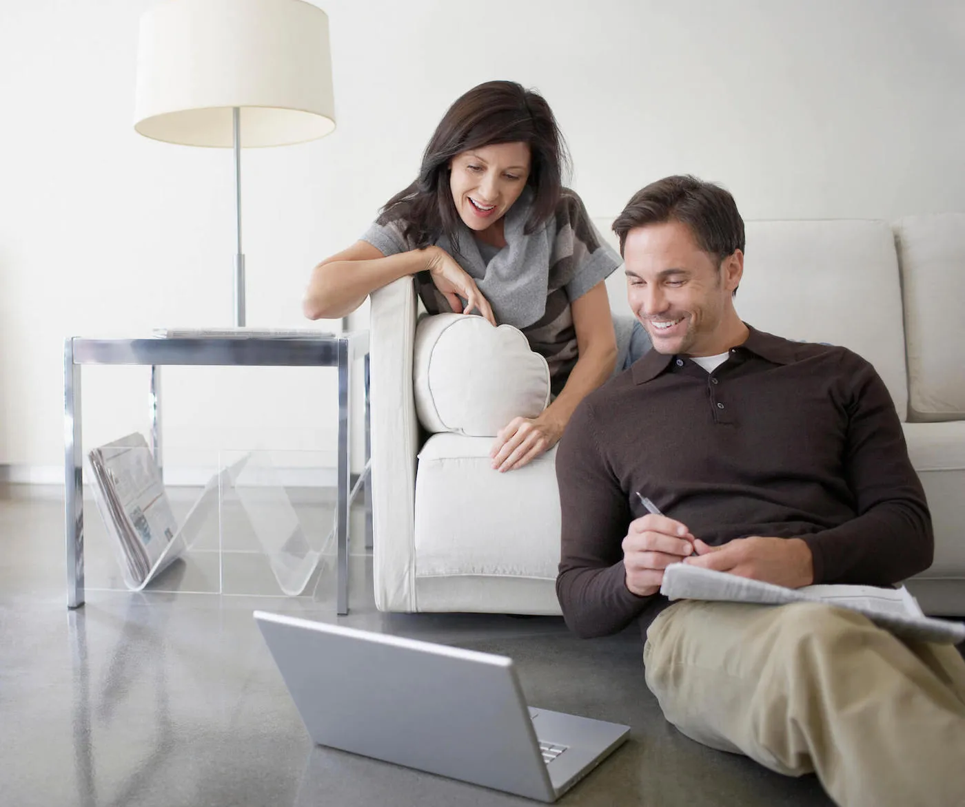 Male and female couple looking up ways to use savings.