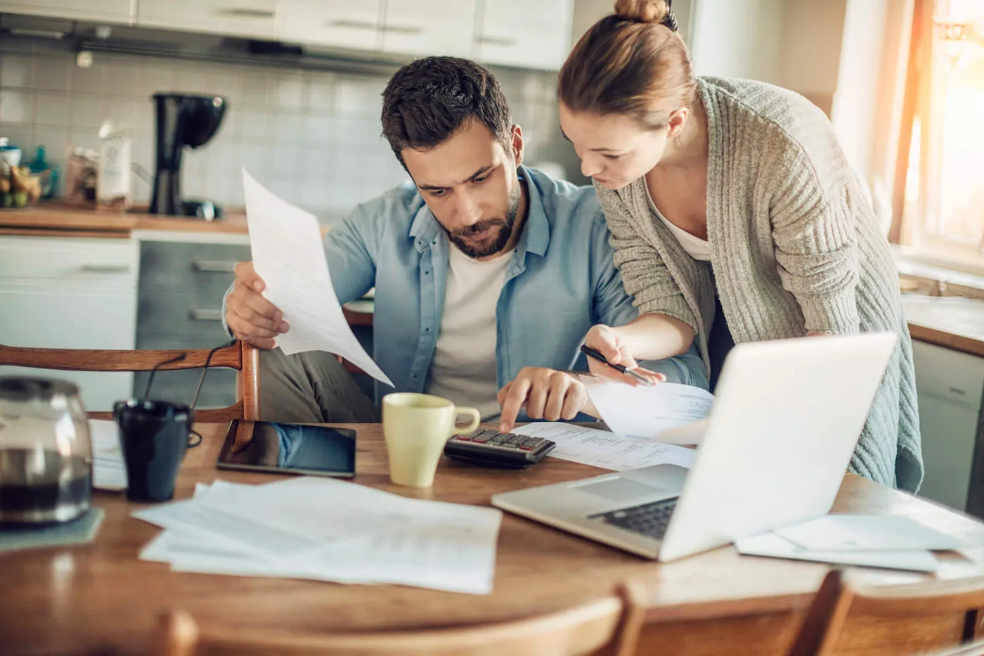 Man and woman looking over health care sharing programs.