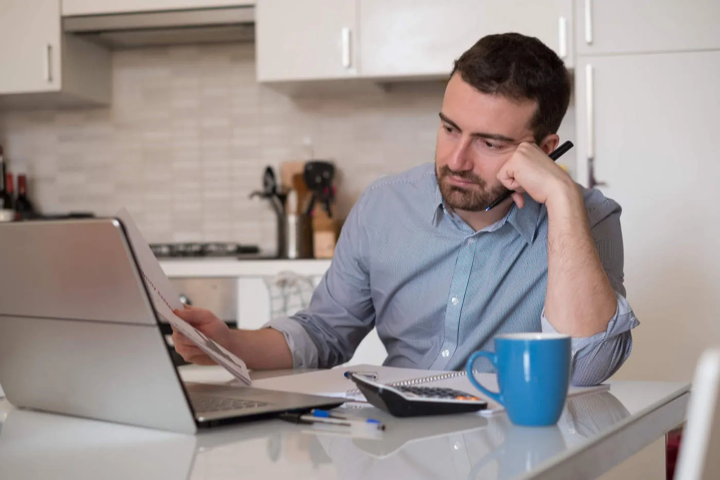 Man looking up online his lona to value ratio for a lender.