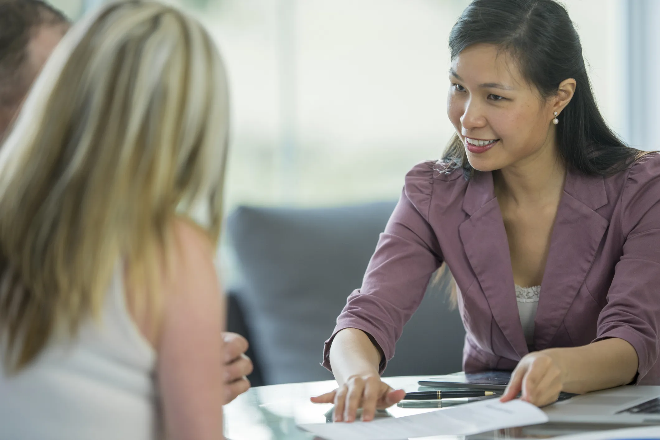 Female agent explaining the personal loan terms to the couple