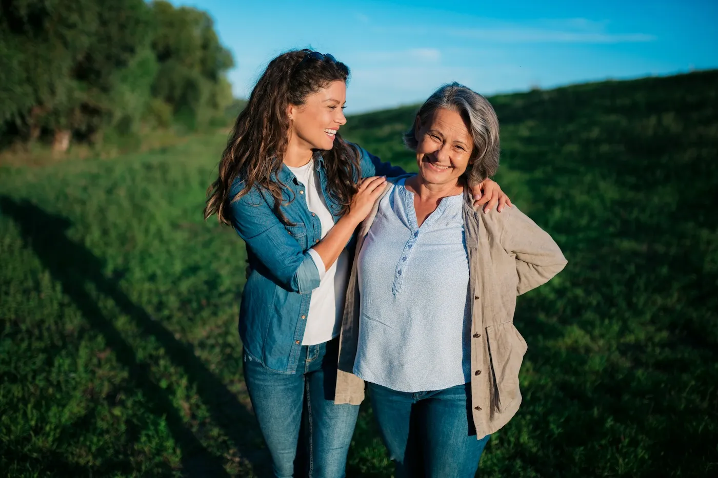 Happy daughter and mother in nature, bonding together, having fun.