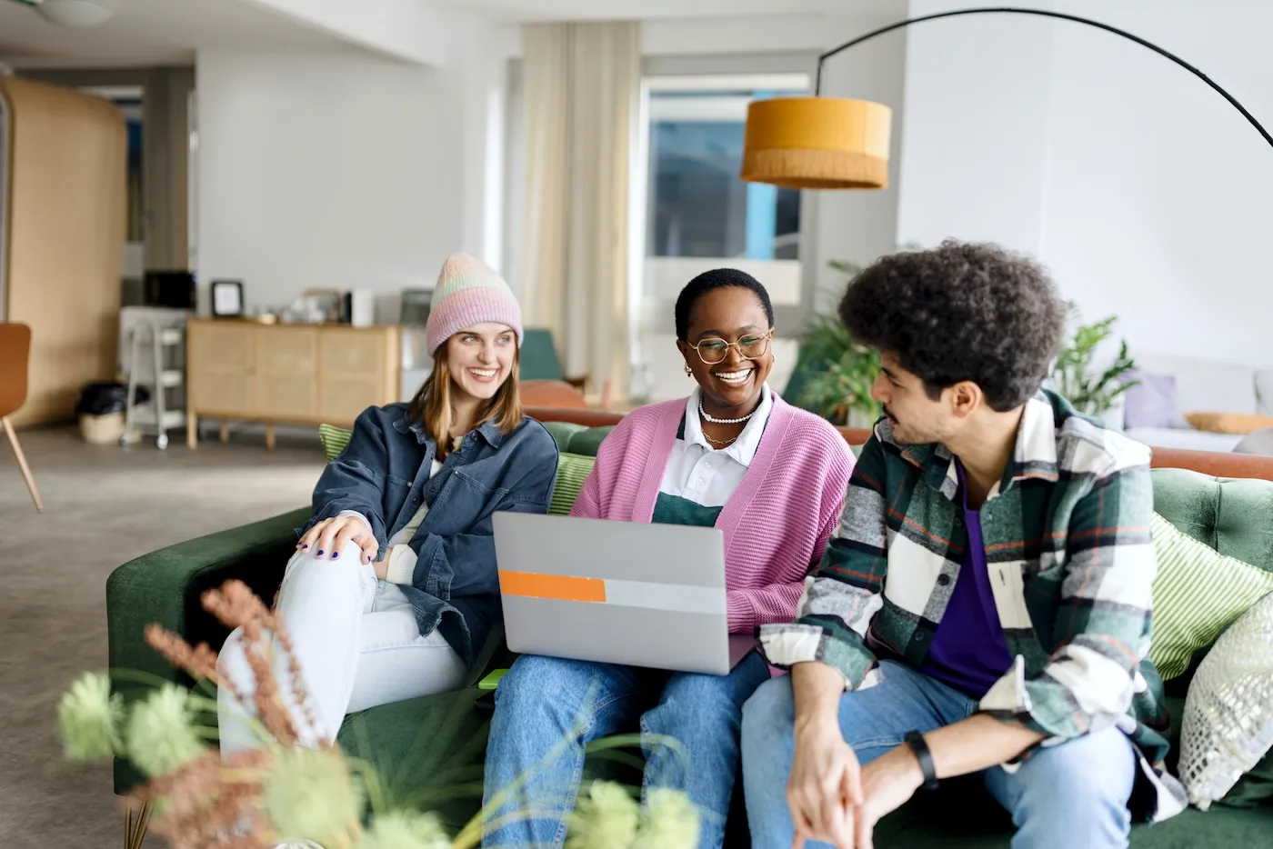 A group of young people discussing at work