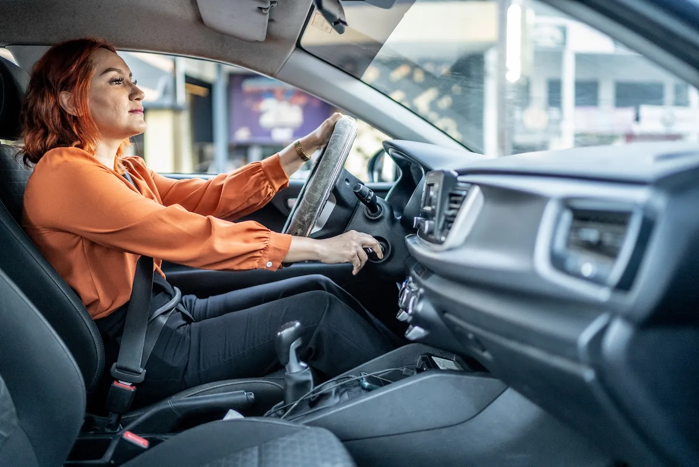 A woman driving a car.