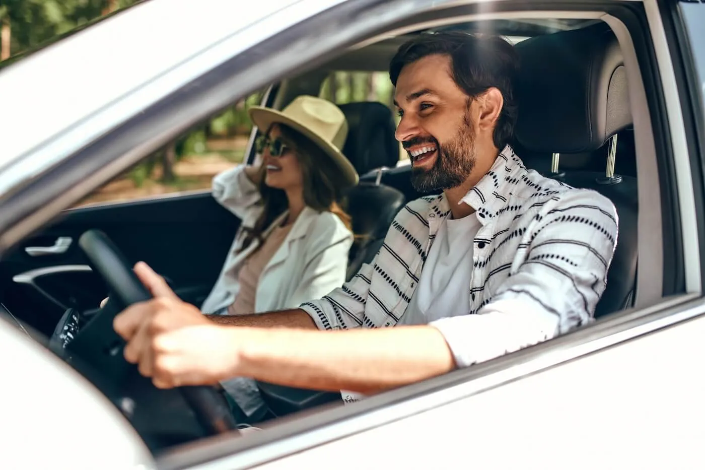 Young couple driving the car