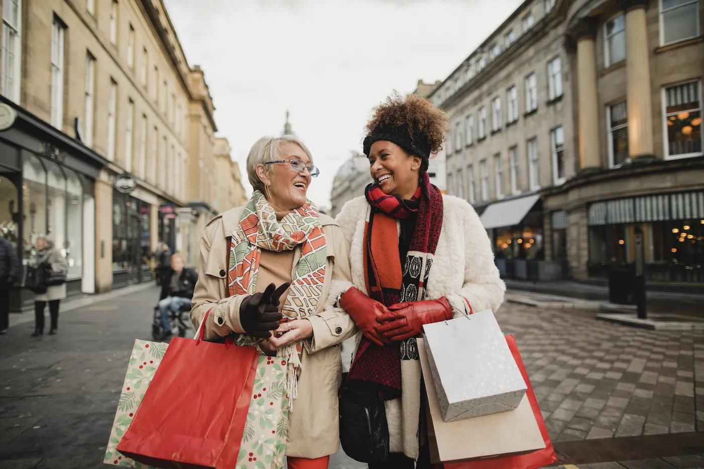 Two friends walking around holiday shopping