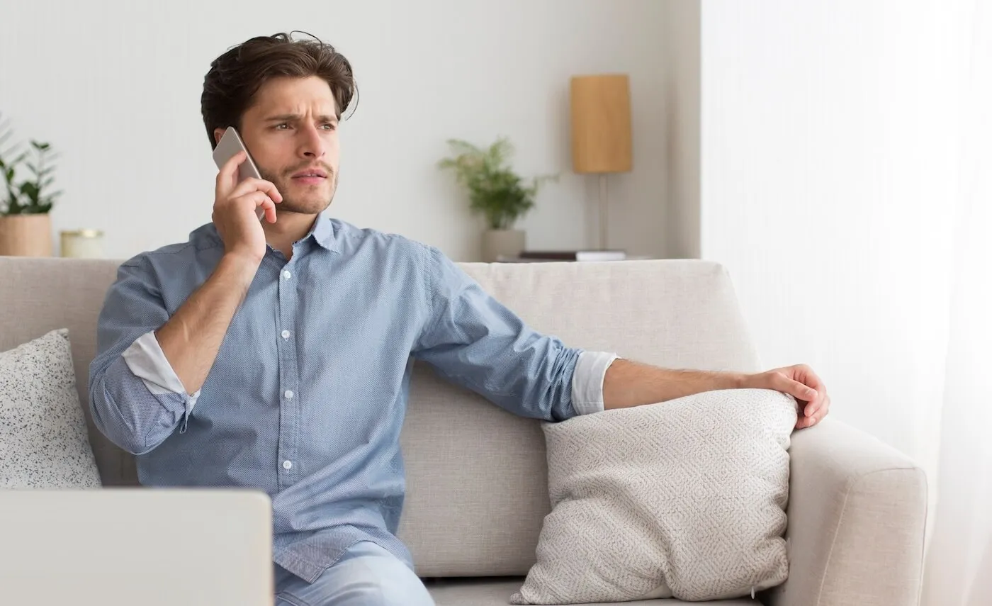 Concerned man making a phone call