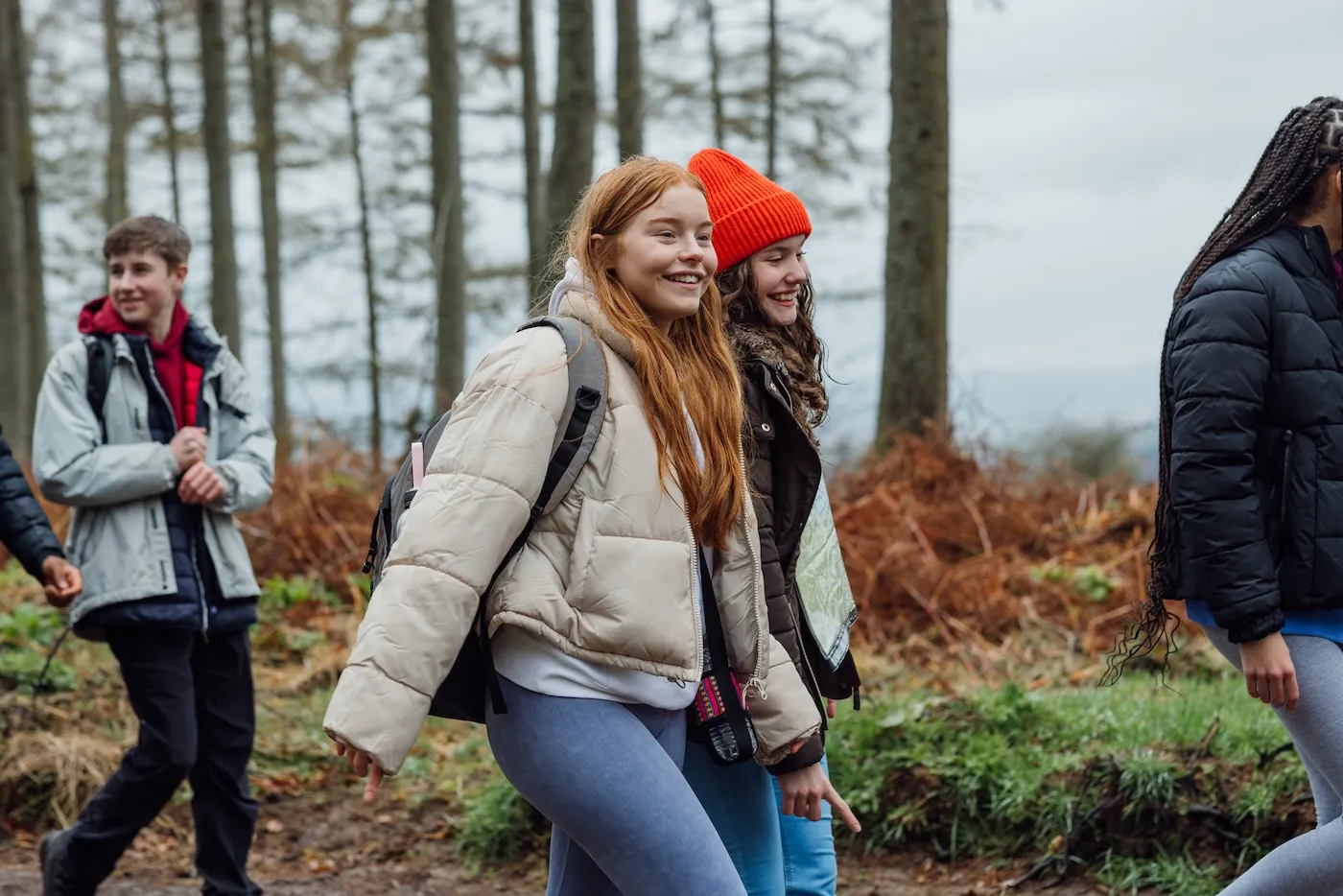 A group of student teenagers are on an educational walk.