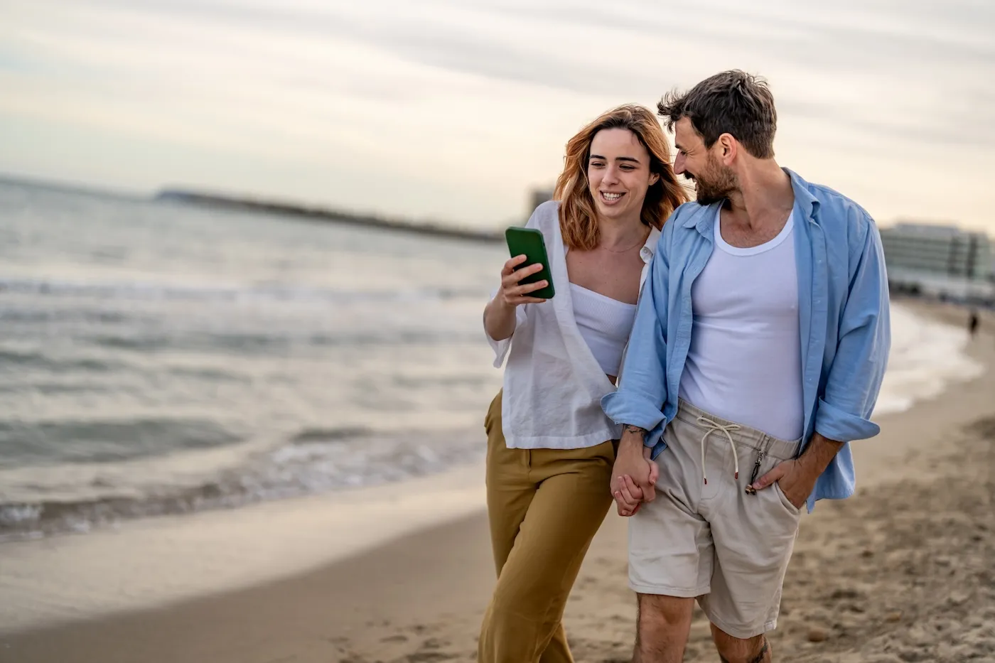 Young happy couple having fun at the beach.