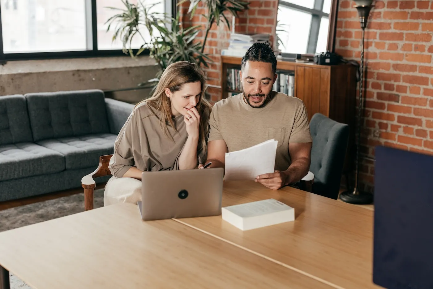 A couple planning their mortgage payments.