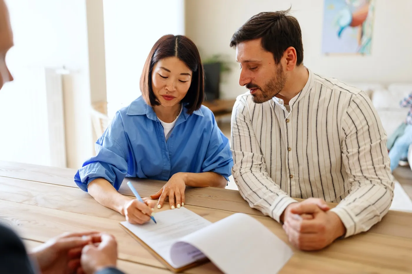 Happy couple working on mortgage