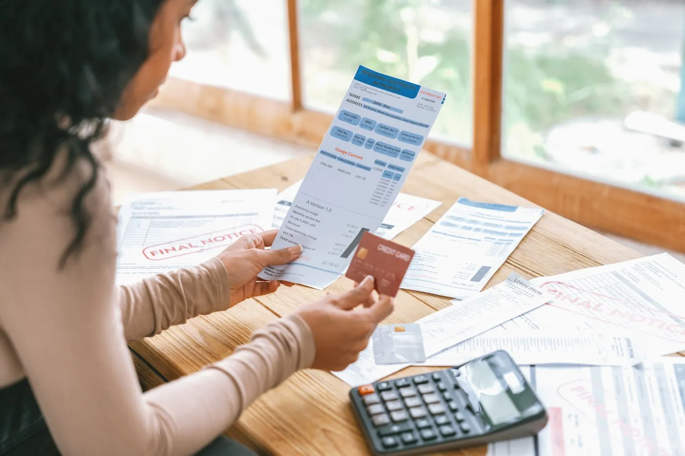 Stressed young woman has financial problems with credit card debt.