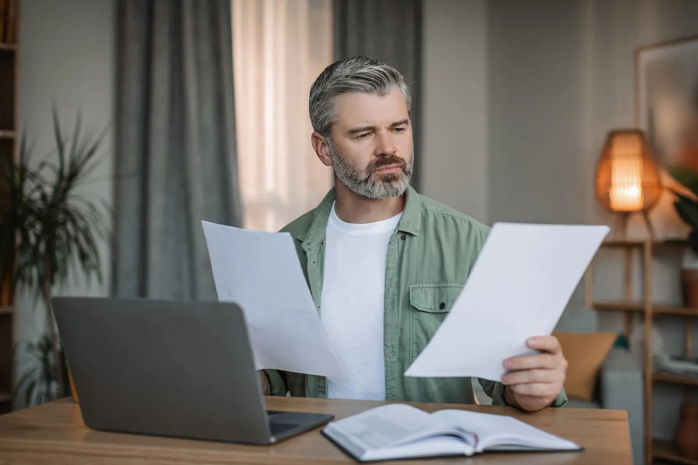 A man reading tax paperwork