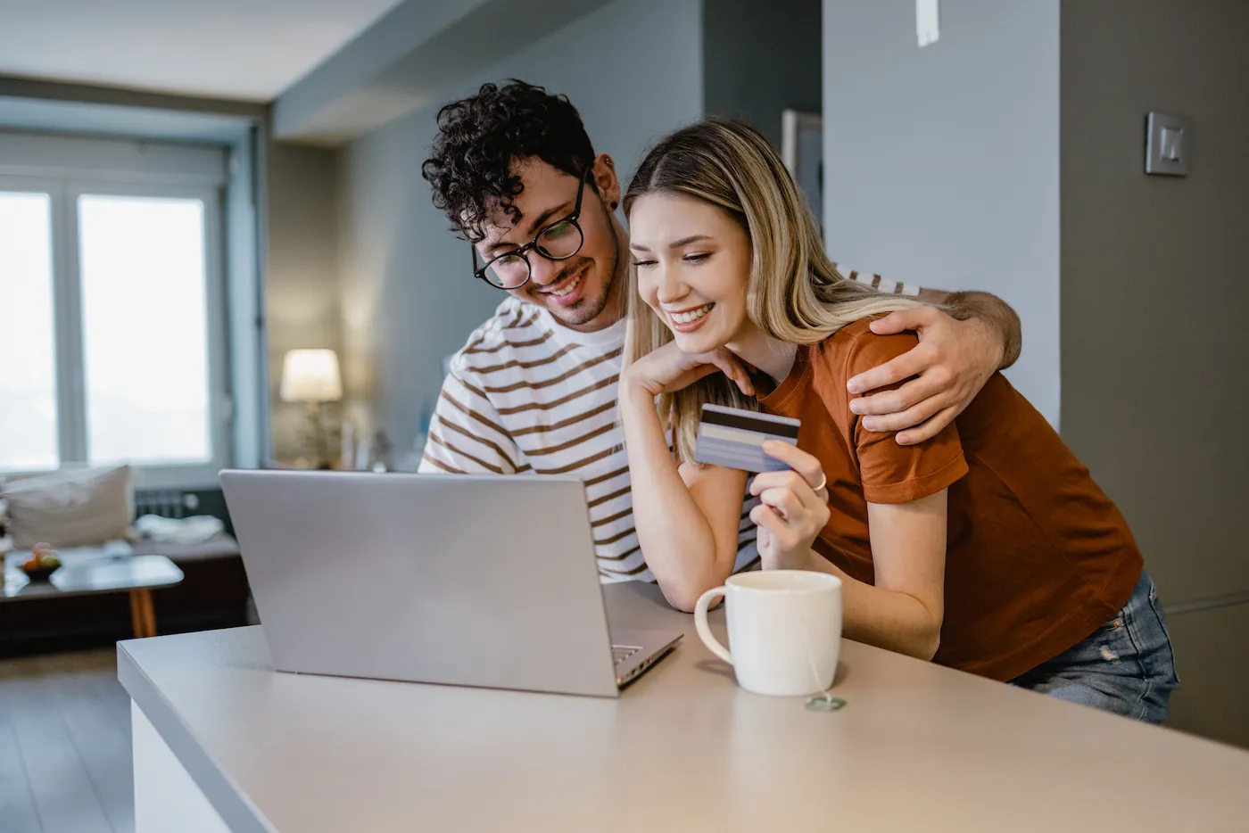 Young couple shopping online and using credit card