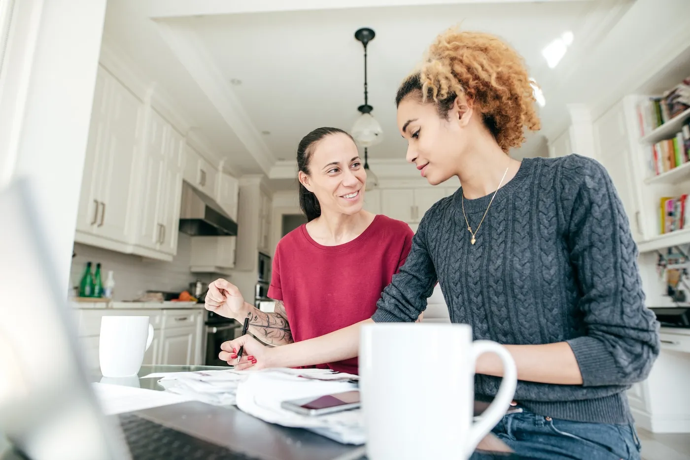 A couple making financial plans, working at home from their kitchen.